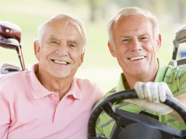 Two Senior Male Golfers in Cart